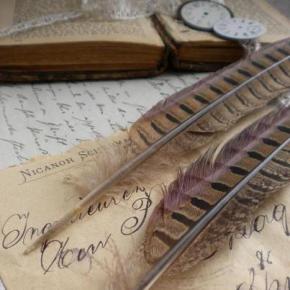 Old pens and documents, symbolizing genealogical research